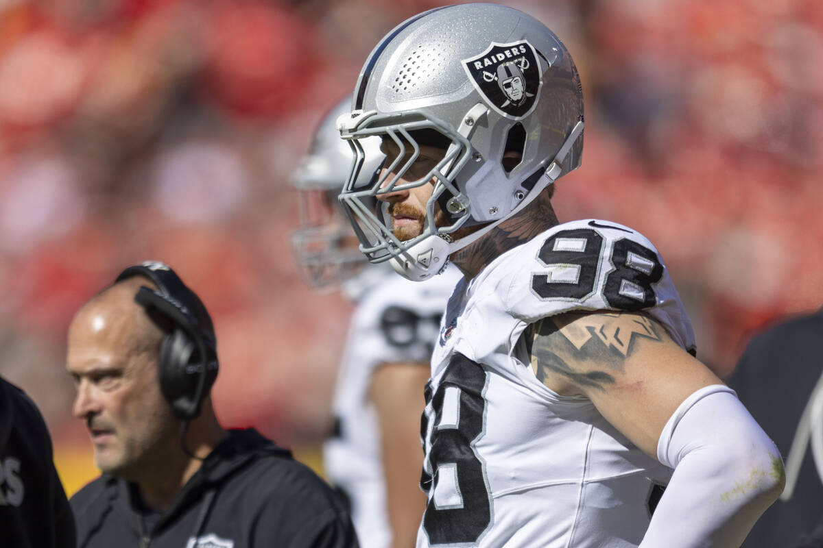 Raiders defensive end Maxx Crosby (98) watches the team play the Kansas City Chiefs from the si ...
