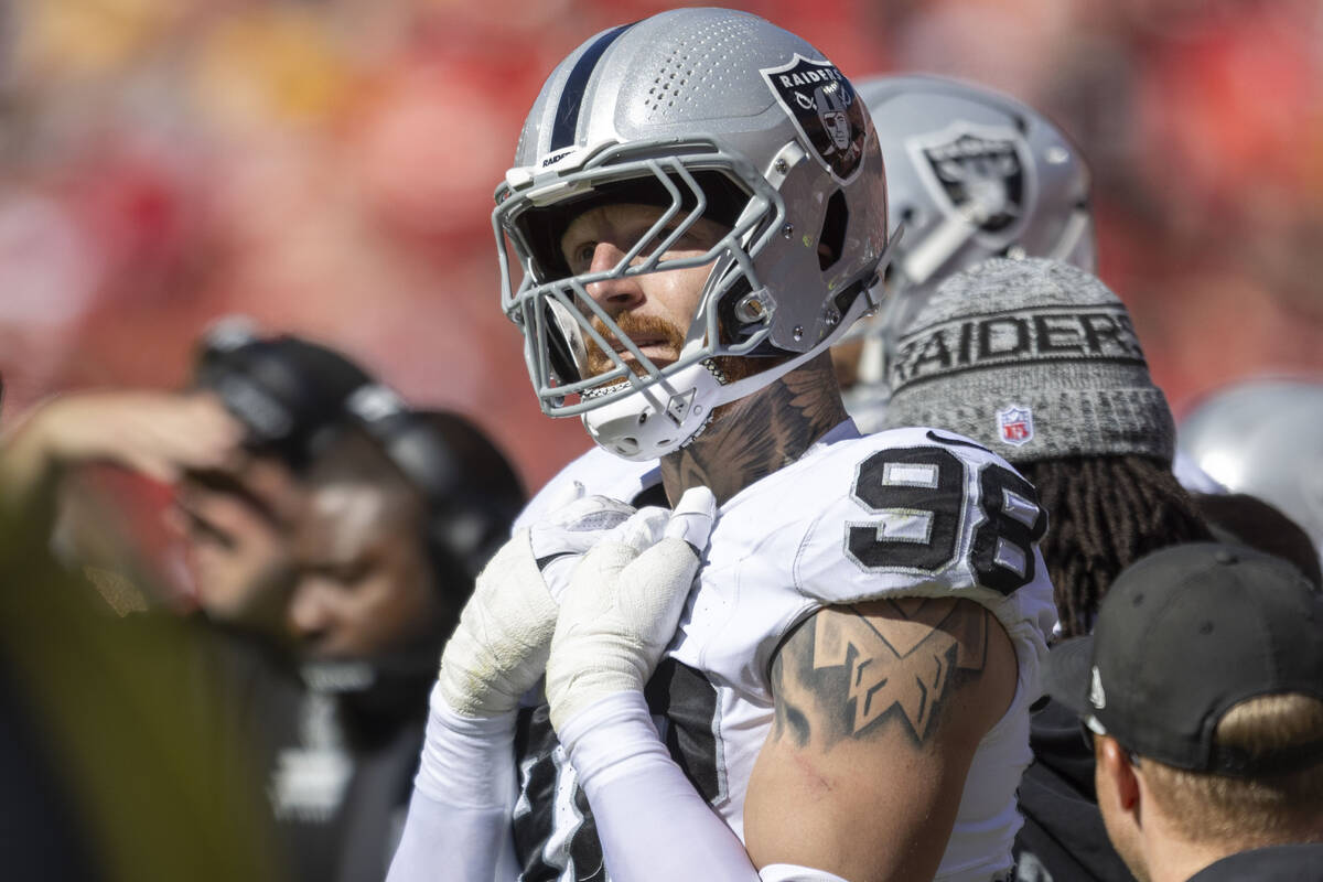 Raiders defensive end Maxx Crosby (98) watches the team play the Kansas City Chiefs from the si ...