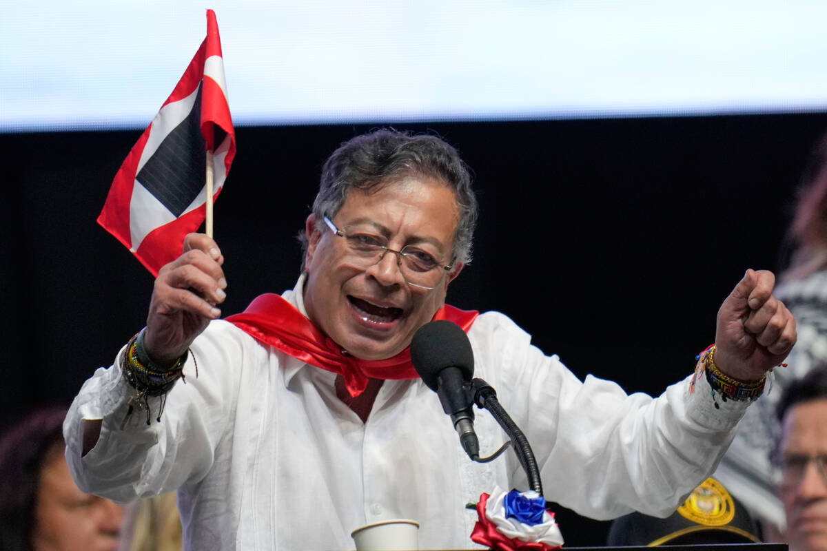 Colombian President Gustavo Petro addresses supporters during a rally in Ibague, Colombia, Frid ...