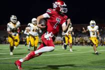Arbor View Quarterback Thaddeus Thatcher (7) runs with the ball during a football game between ...