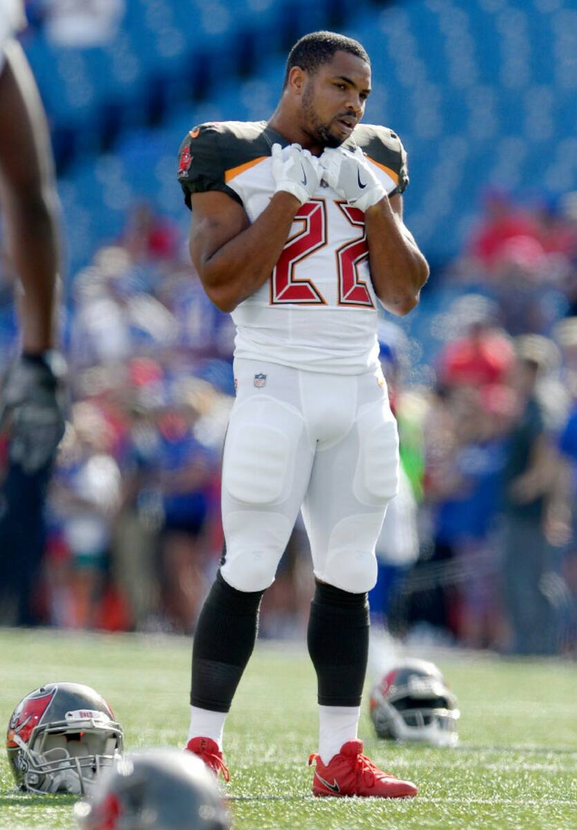 Tampa Bay Buccaneers running back Doug Martin (22) stretches before an NFL football game agains ...