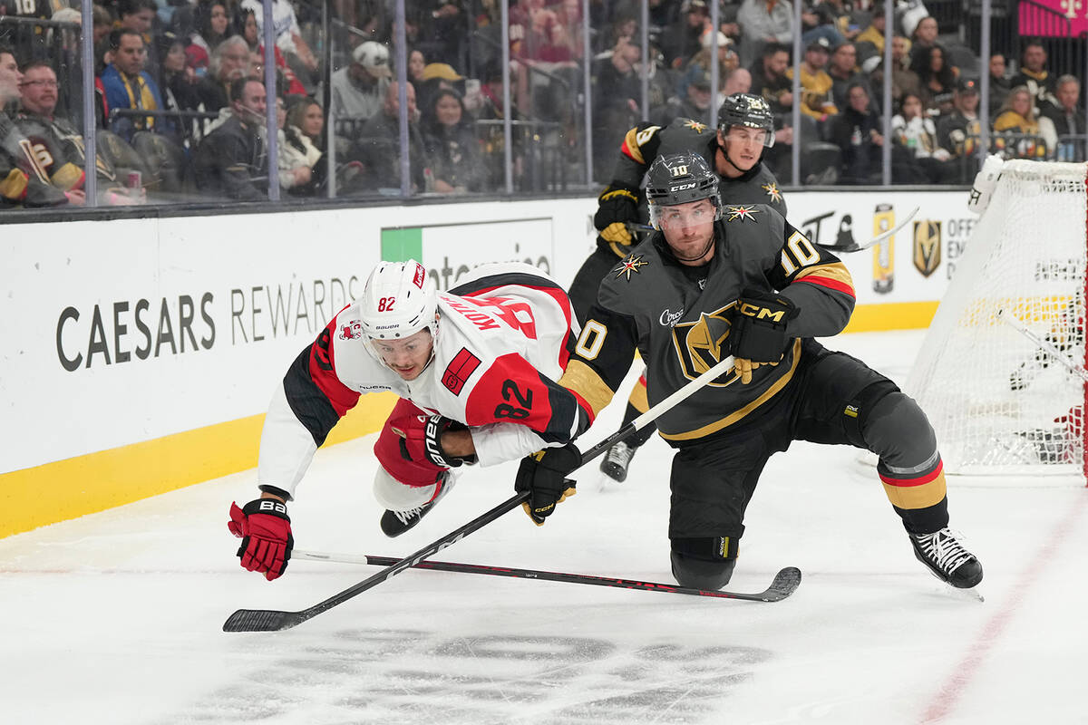 Carolina Hurricanes center Jesperi Kotkaniemi (82) collides with Vegas Golden Knights center Co ...