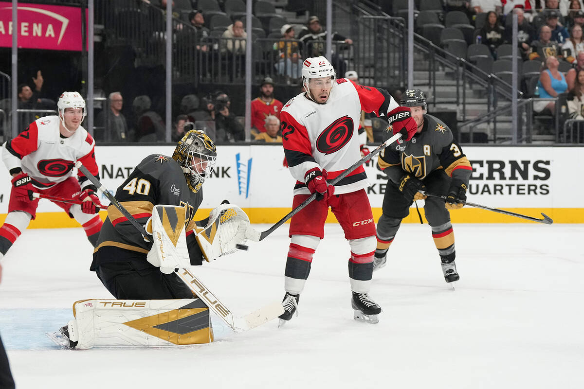 Vegas Golden Knights goaltender Akira Schmid (40) stops a shot from the Carolina Hurricanes dur ...