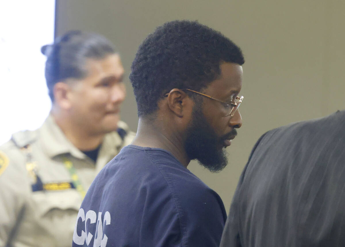 Christopher Walker, center, who was found guilty in a DUI crash that killed a pregnant woman an ...