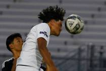 Sunrise Mountain striker Leandro Molina Siam (4) goes for a header against Desert Pines during ...