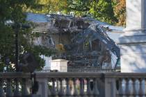 Work begins on the demolition of a part of the East Wing of the White House, Monday, Oct. 20, 2 ...