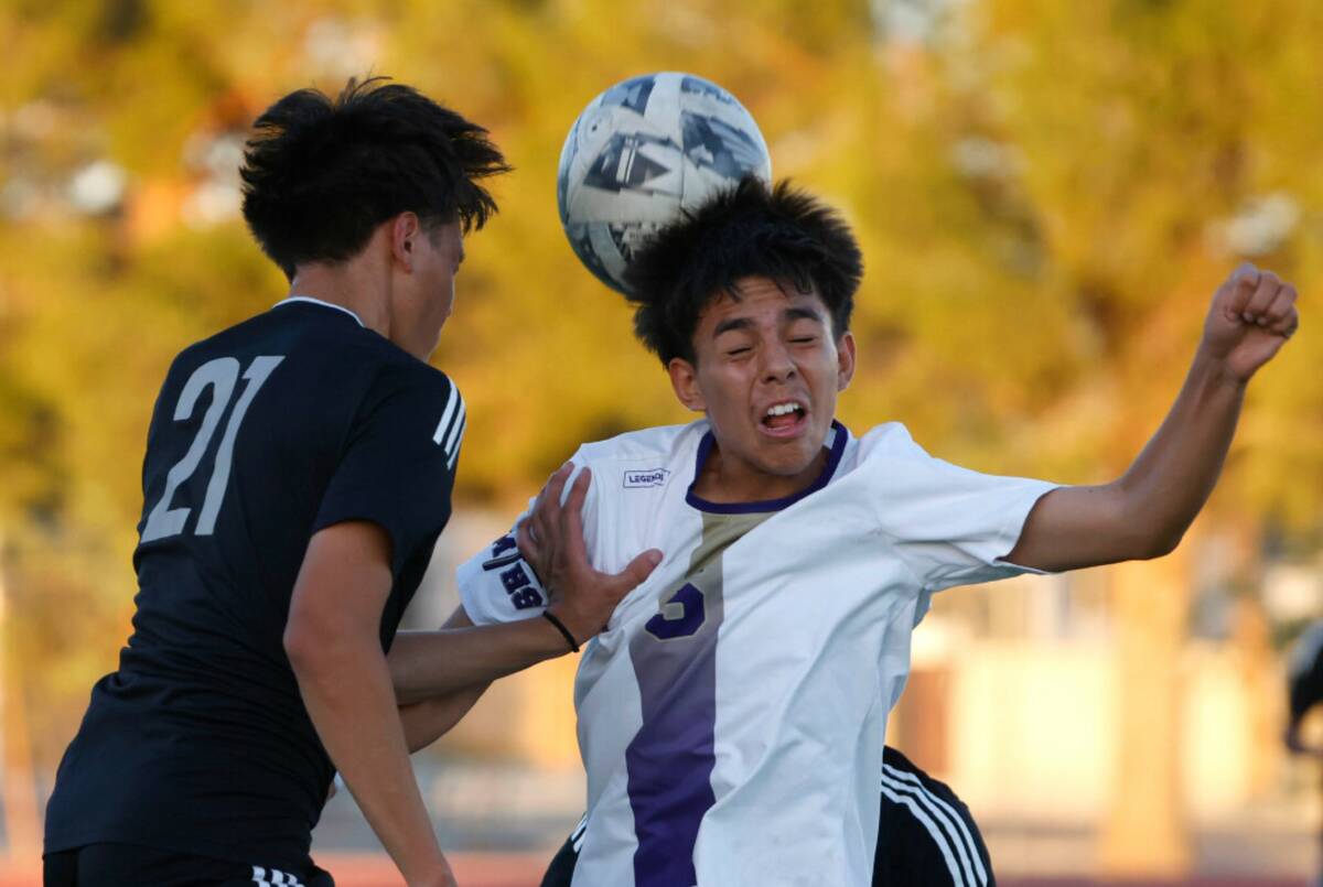 Sunrise Mountain central midfielder Mario Dominguez (5) and Desert Pines midfielder Raul Pleite ...