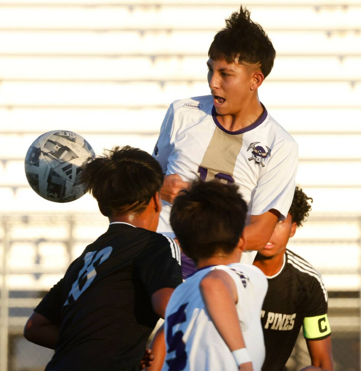 Sunrise Mountain left back Cristopher Munoz Martinez (12) blocks the ball during a high school ...