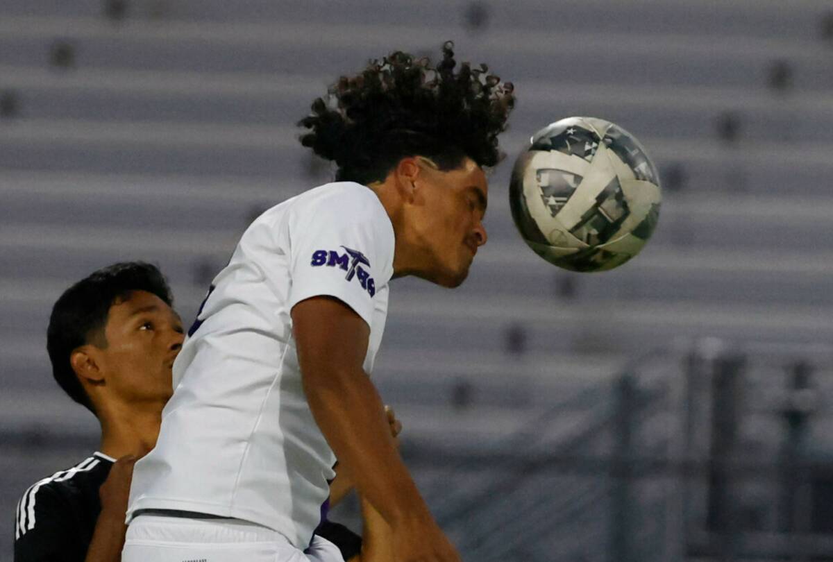 Sunrise Mountain striker Leandro Molina Siam (4) goes for a header against Desert Pines during ...