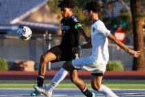 Sunrise Mountain central defensive midfielder Antonio Beltran (17) and Desert Pines midfielder ...