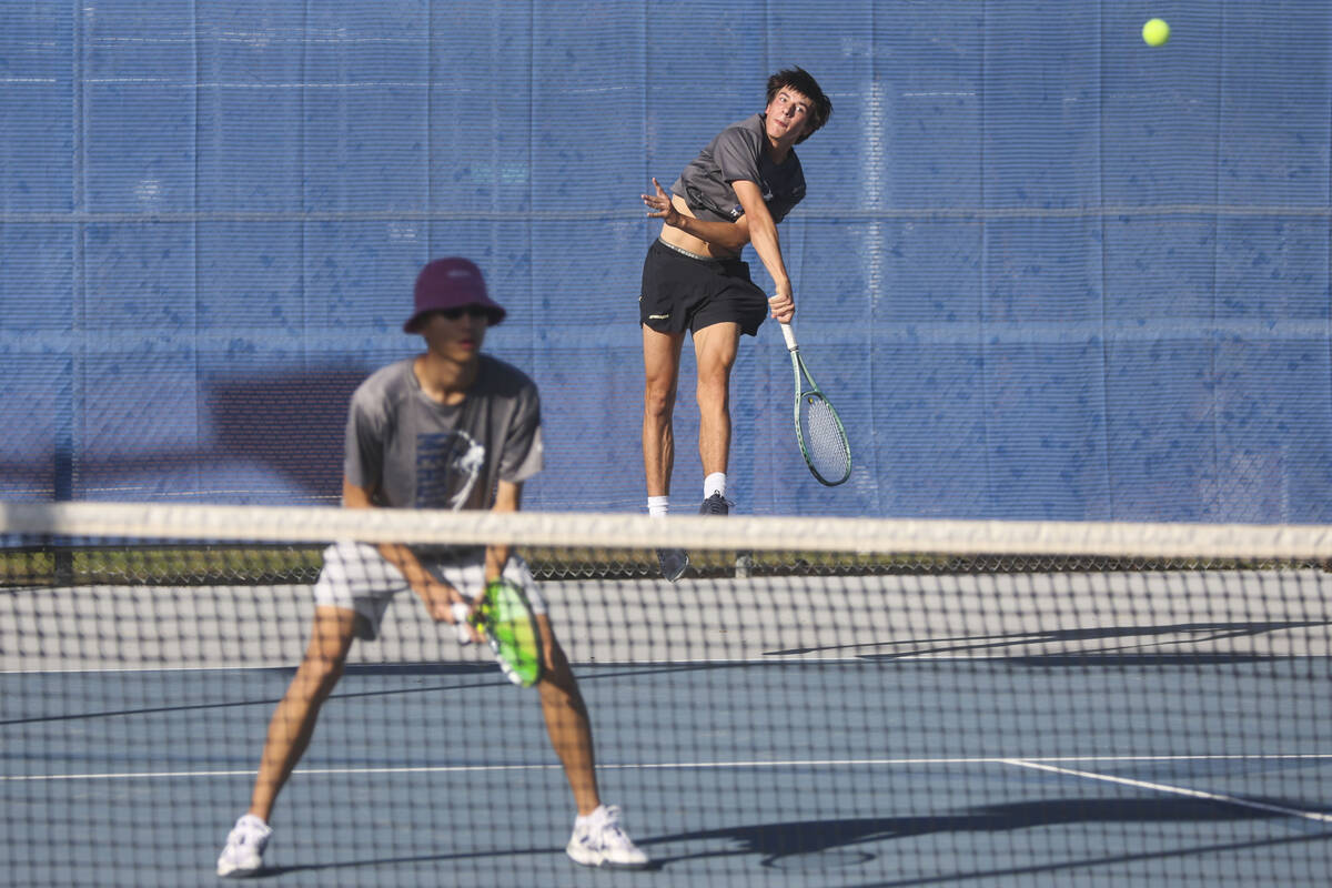 The Meadows’ Matthew Maddox serves the ball alongside Steven Tian while playing doubles ...