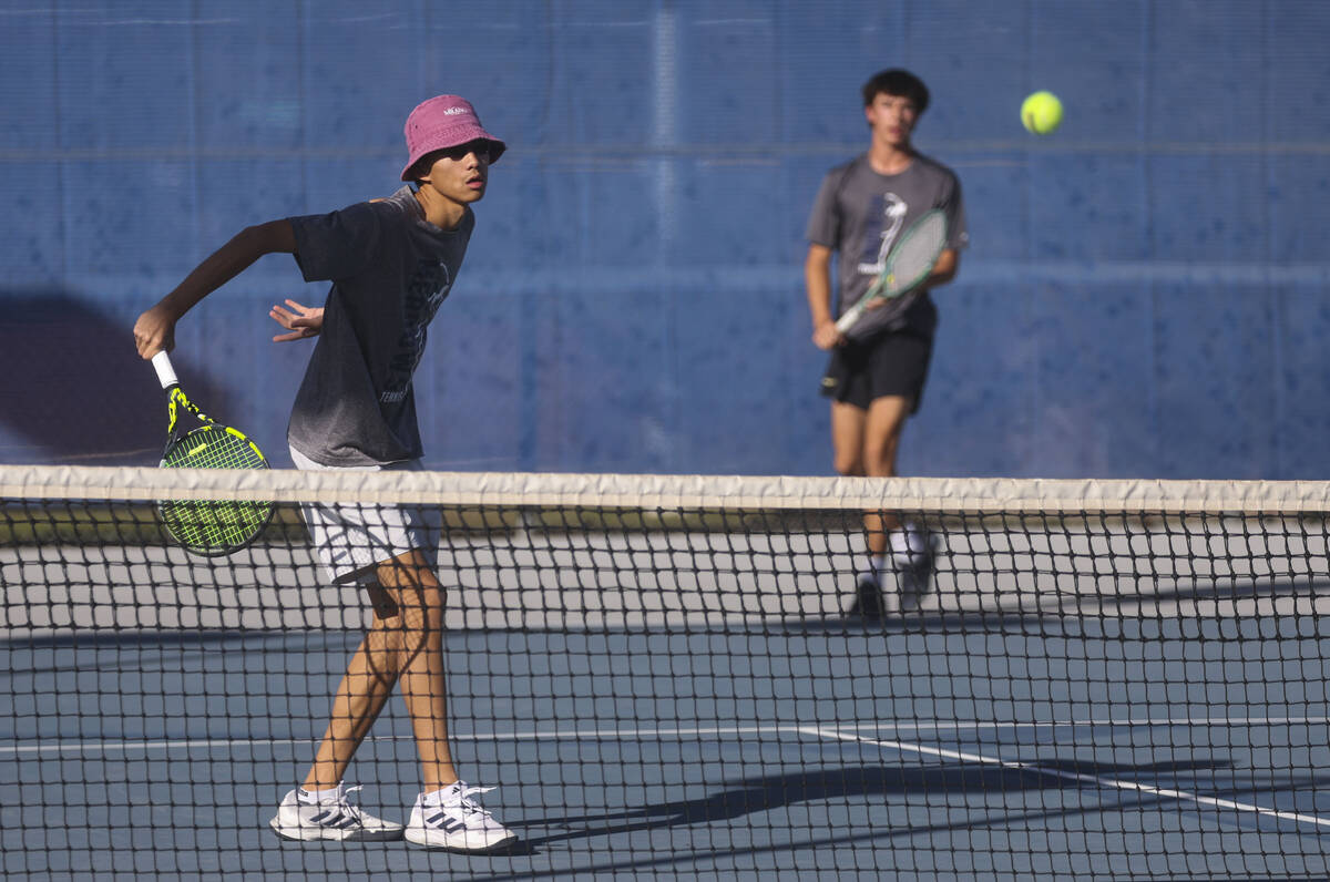 The Meadows’ Steven Tian hits the ball while playing doubles with Matthew Maddox against ...