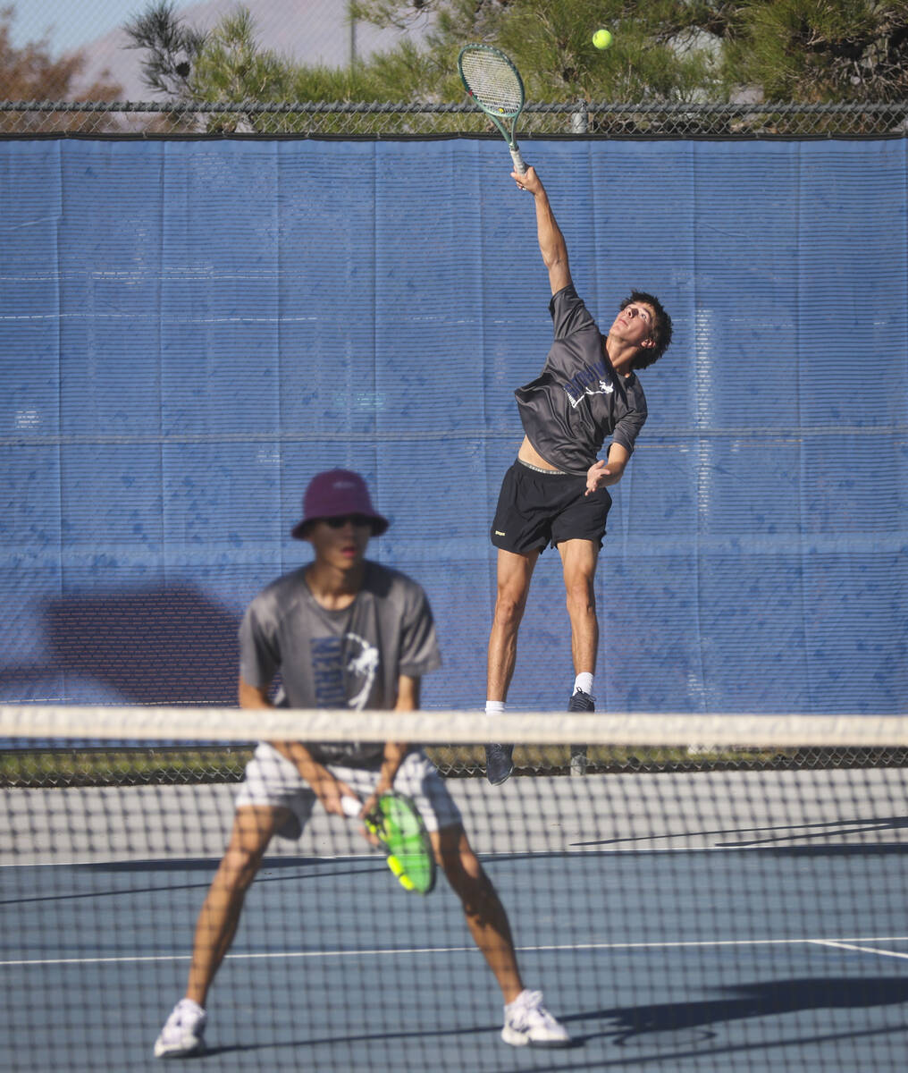 The Meadows’ Matthew Maddox serves the ball alongside Steven Tian while playing doubles ...