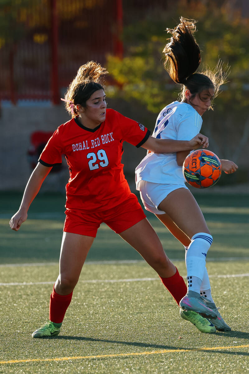 Doral Academy forward Sienna Turco (29) and Sierra Vista defender Isabella Simental (13) pursue ...