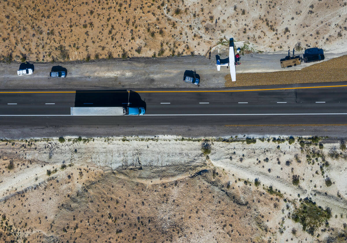 A plane piloted by Tzuriel Urbano rests on the shoulder of Interstate 15 north of Las Vegas aft ...