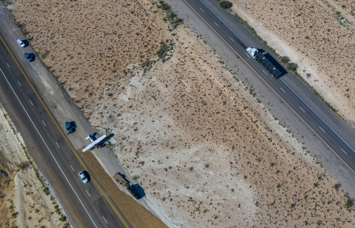 A plane piloted by Tzuriel Urbano rests on the shoulder of Interstate 15 north of Las Vegas aft ...