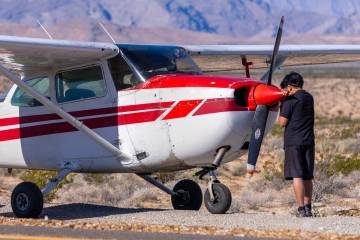Pilot Tzuriel Urbano stands next to the nose of his plane after safely landing it on Interstate ...