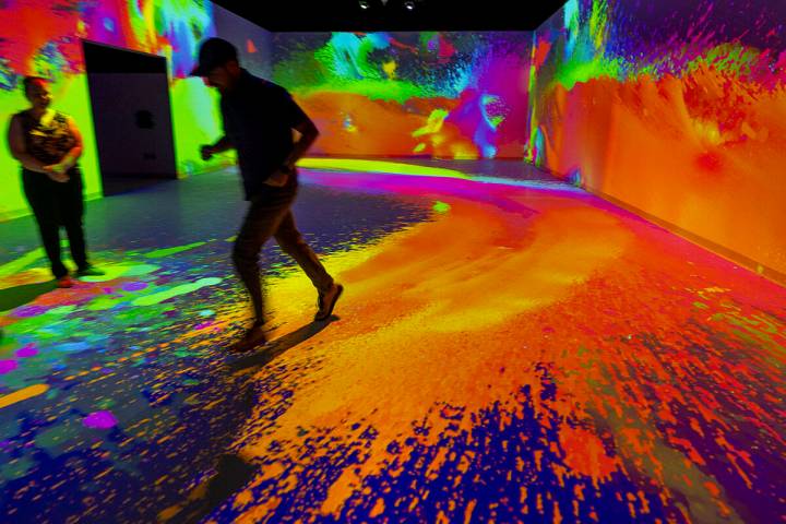 CEO/Co-Founder Brandon Garrett runs through a main gaming area as light paints his movements at ...