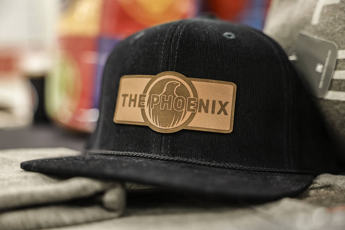 Welcome kits, including hats, are seen at The Phoenix, a national sober active community that e ...
