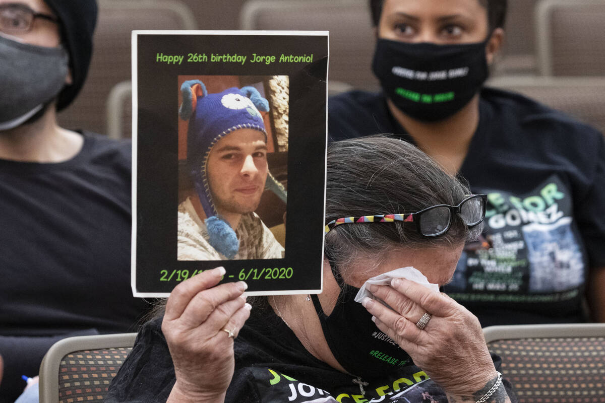Carol Luke, holding a photograph of Jorge Gomez, a Black Lives Matter protester who was fatally ...