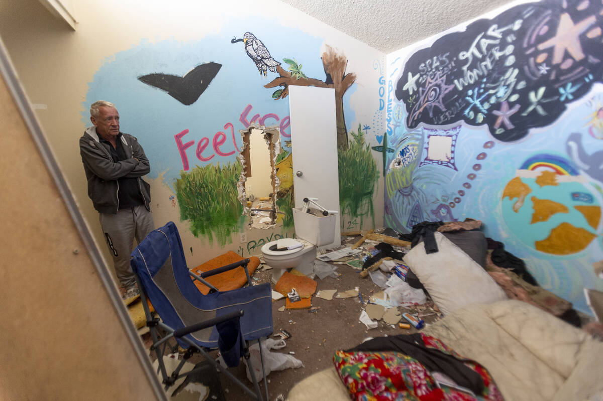 Paradise Spa homeowners' association president Dennis Snapp shows the inside of a condo that wa ...