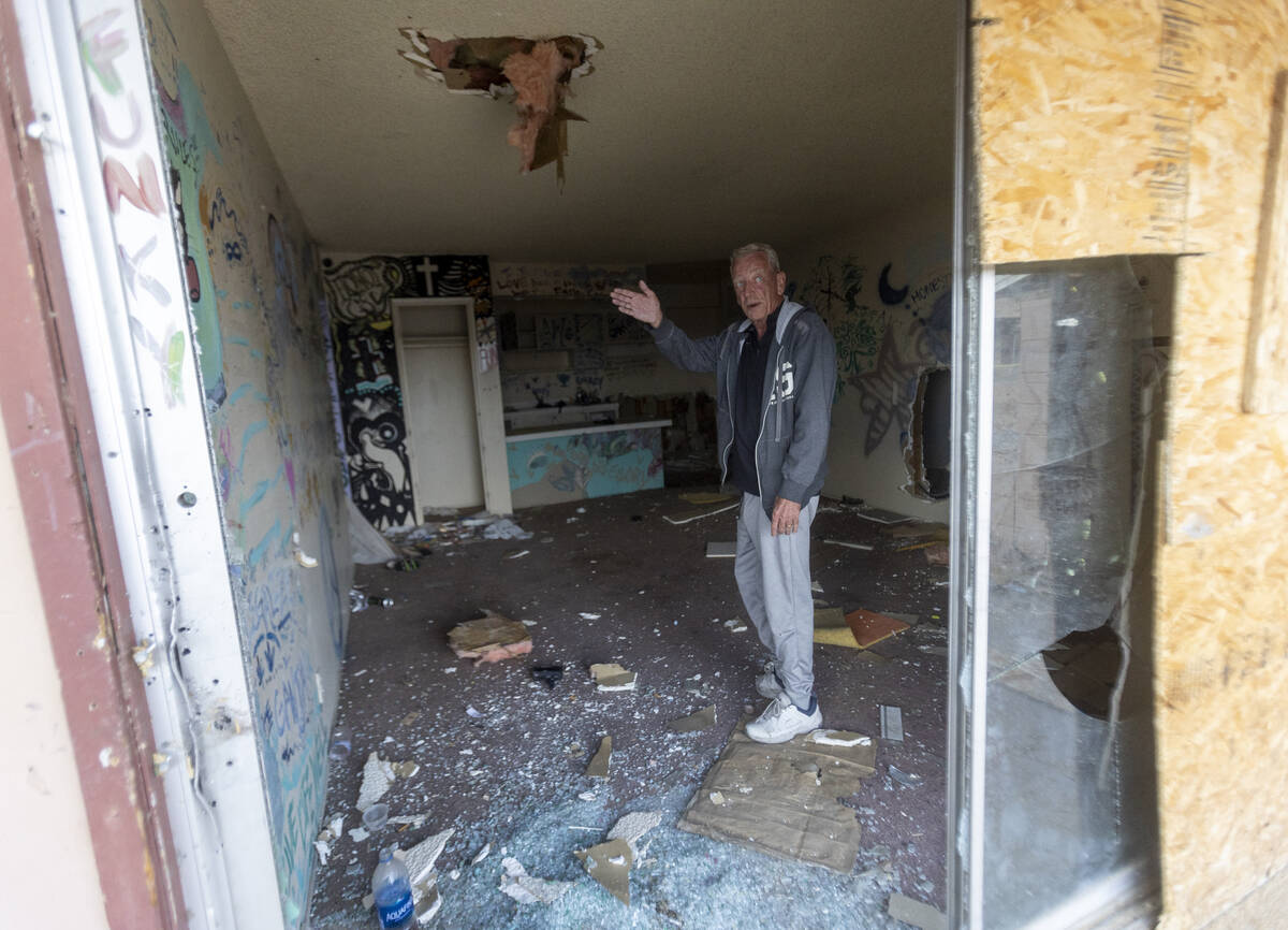 Paradise Spa homeowners' association president Dennis Snapp shows the inside of a condo that wa ...