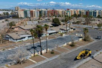 The rundown former Paradise Spa condo complex, in the foreground, is set to be redeveloped into ...