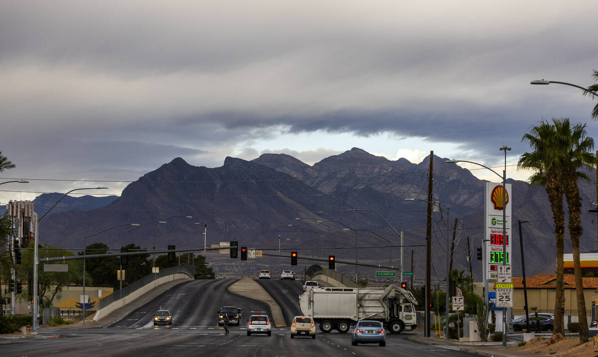 Clouds hug the mountains above the Red Rock Conservation Area as rain moves through the area on ...