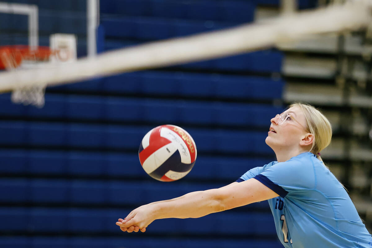 Foothill middle blocker Marlee Kinder (11) passes from the front row during a volleyball game o ...