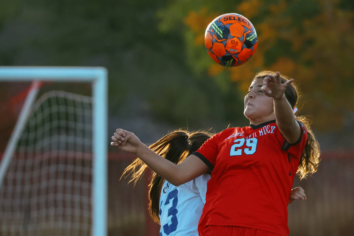 Doral Academy forward Sienna Turco (29) heads the ball over Sierra Vista defender Isabella Sime ...