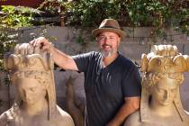 Collector Jeff Young poses for a photo with sculptures he believes survived the infamous MGM Gr ...