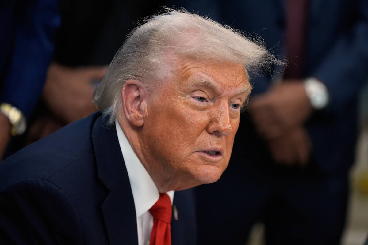 President Donald Trump answers questions from reporters during a Diwali celebration in the Oval ...