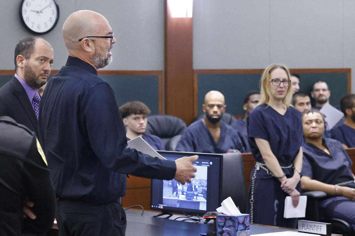 Chief Deputy District Attorney Christopher Hamner, left, listens as Ghost Adventures Star Aaron ...
