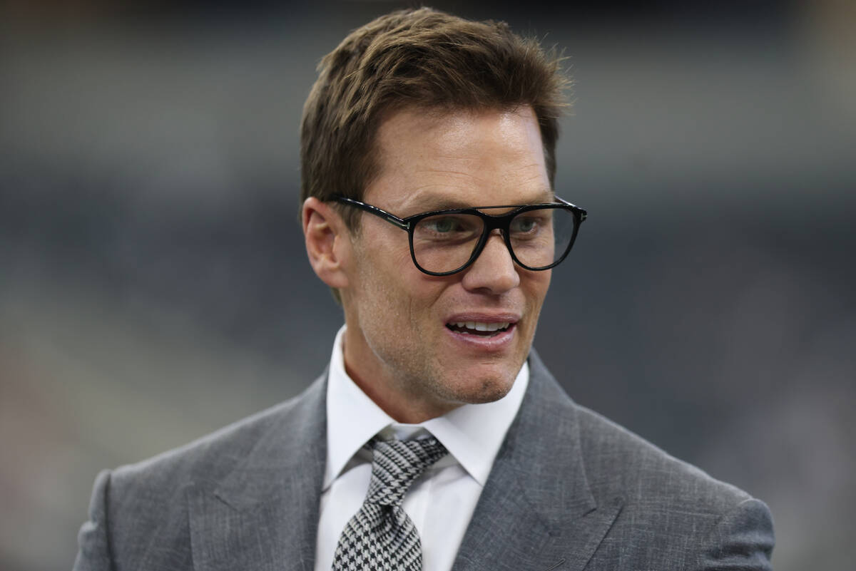 Former NFL quarterback Tom Brady looks on prior to an NFL football game between the Dallas Cowb ...