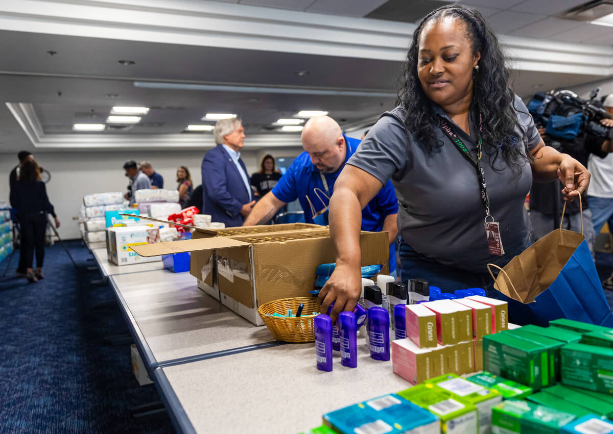 LaTonya Byrd, management analyst with the Clark County Department of Aviation, organizes donate ...