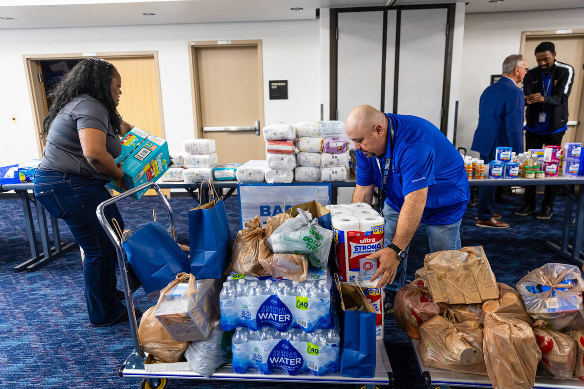 LaTonya Byrd, left, and Oscar Hernandez, both with the Clark County Department of Aviation, org ...