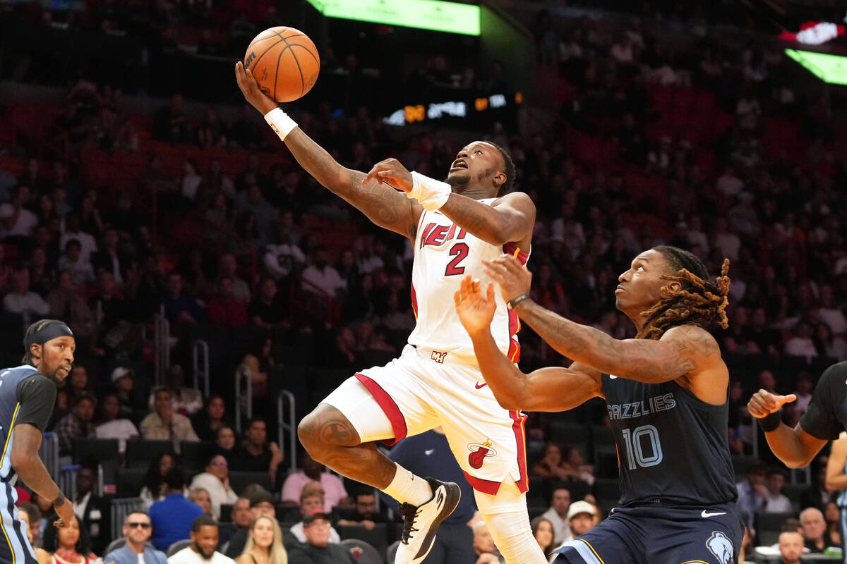 Miami Heat guard Terry Rozier (2) drives to the basket as Memphis Grizzlies guard Javon Small ( ...