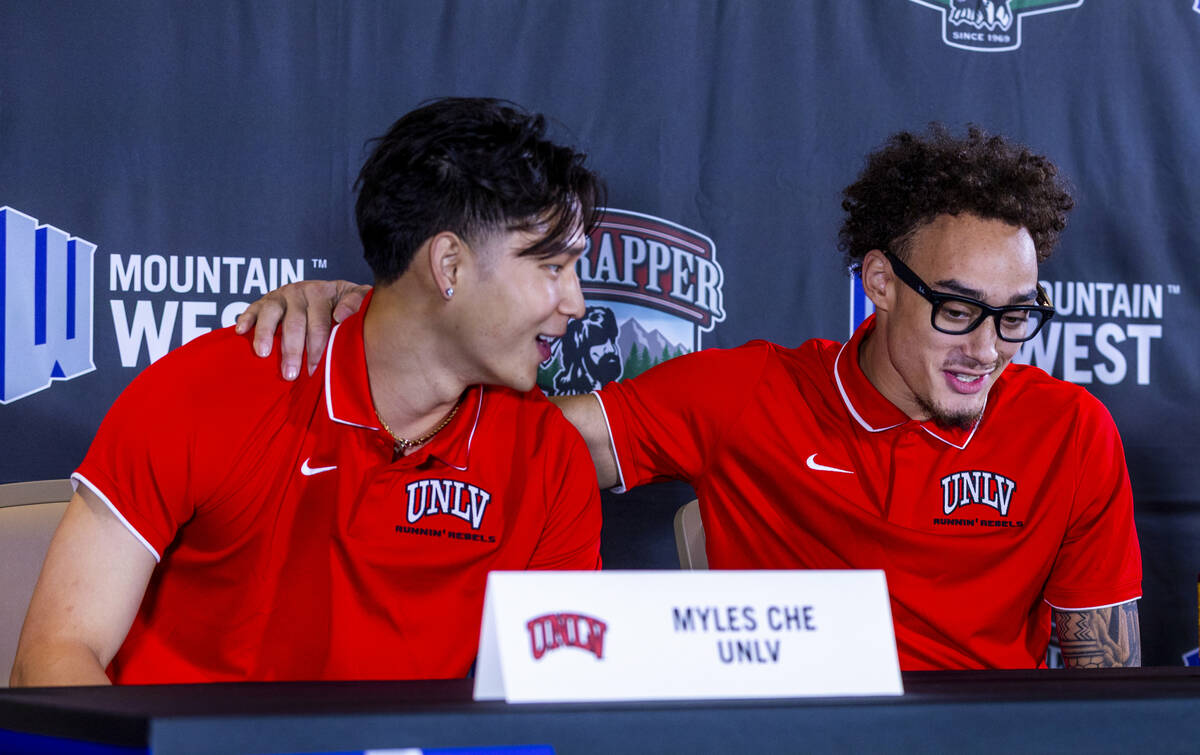 UNLV player Myles Che comes together with teammate Dravyn Gibbs-Lawhorn as they answer questio ...
