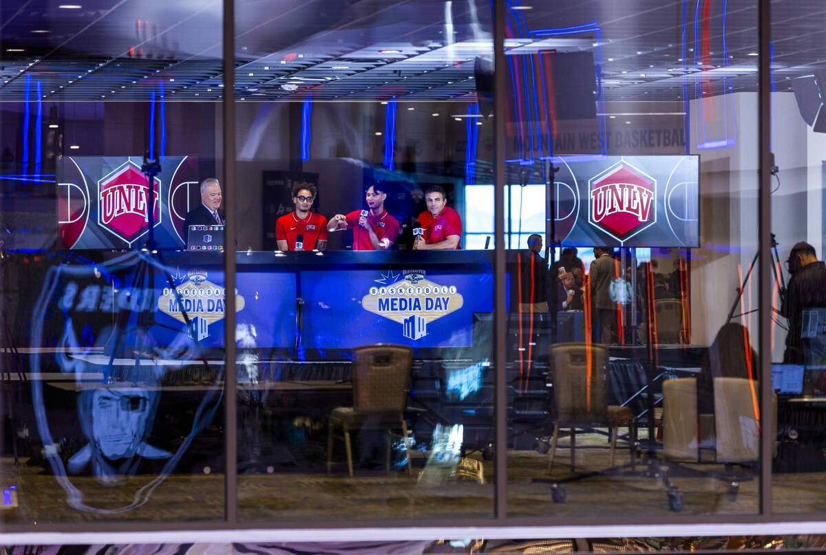 UNLV player Myles Che, center, answers a question joined by and teammate Dravyn Gibbs-Lawhorn, ...