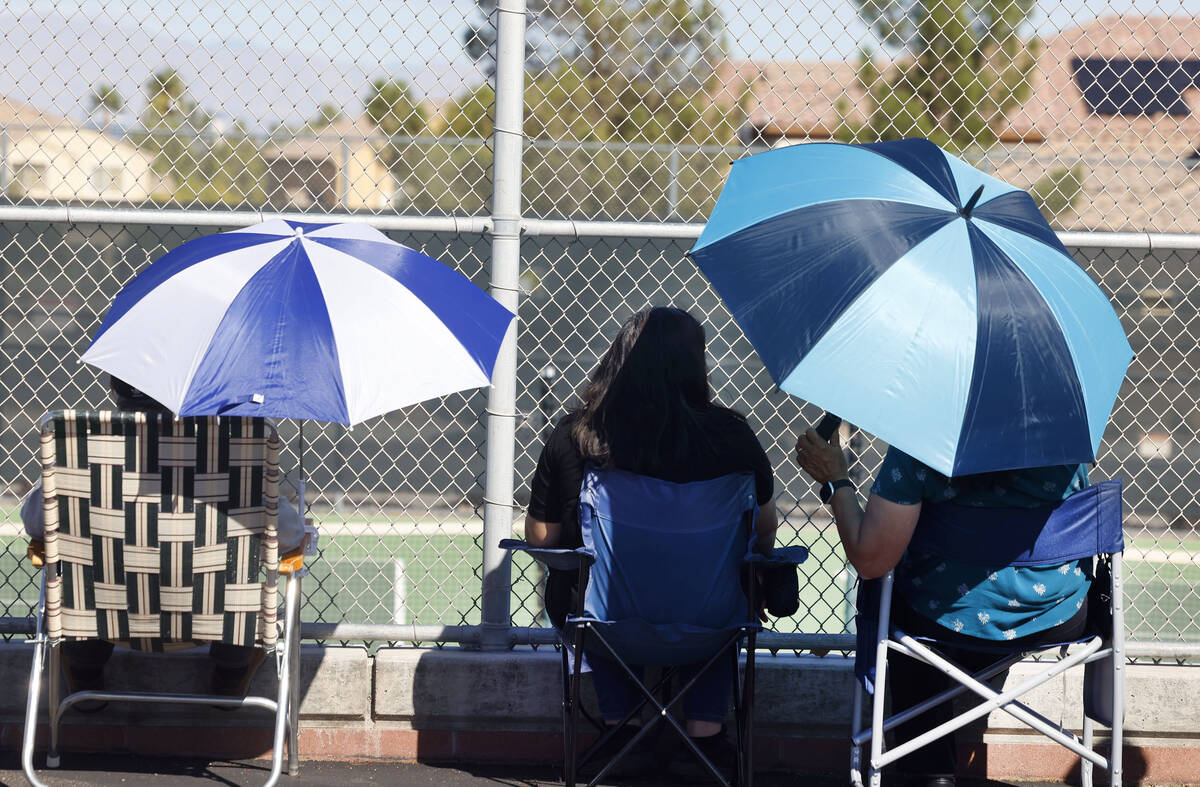 Fans watch the 4A tennis team State semifinal match between the Meadows and Liberty at Liberty ...