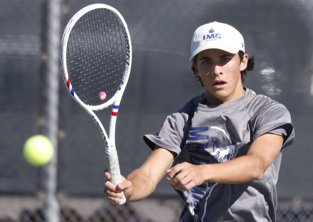The Meadows' Jacob Garber returns the ball against Liberty during the 4A tennis team State ...
