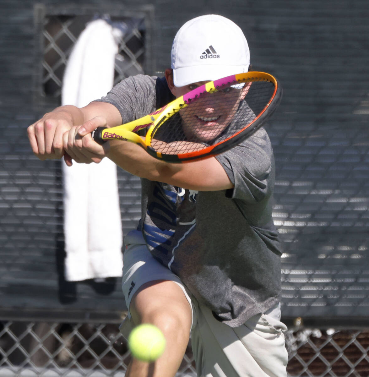 The Meadows' Alec Kosyagin returns the ball against Liberty during the 4A tennis team Stat ...
