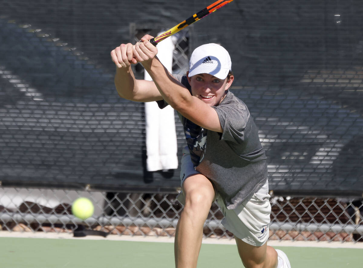 The Meadows' Alec Kosyagin returns the ball against Liberty during the 4A tennis team Stat ...
