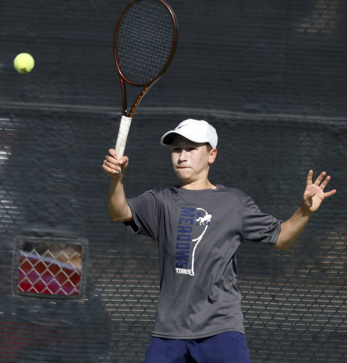 The Meadows' Levi Schaner returns the ball against Liberty during the 4A tennis team State ...
