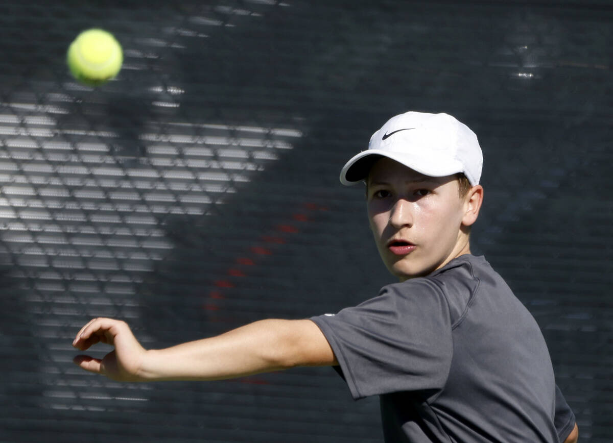 The Meadows' Levi Schaner prepares to return the ball against Liberty during the 4A tennis ...