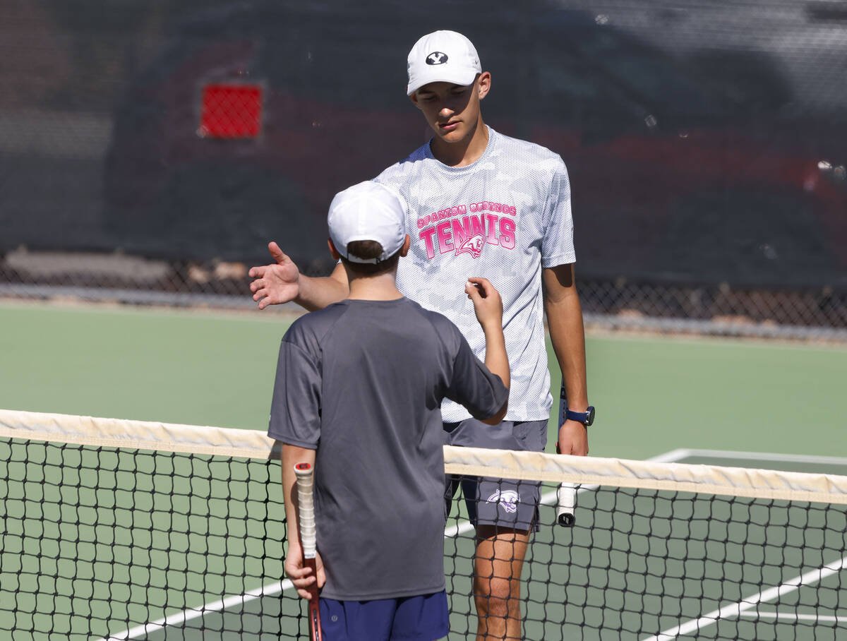 The Meadows' Levi Schaner, front, and Liberty's Ray Ross shake hands after their 4A t ...