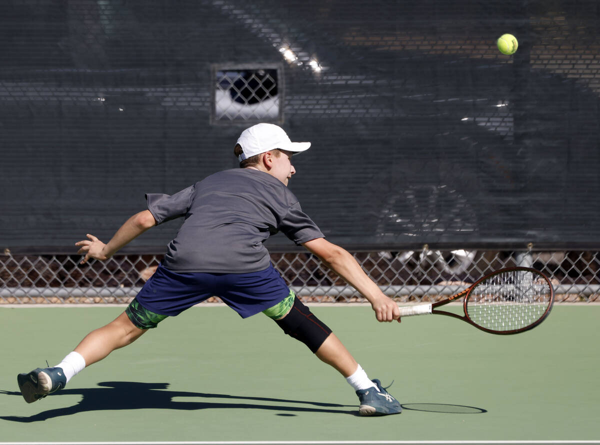The Meadows' Levi Schaner returns the ball against Liberty during the 4A tennis team State ...