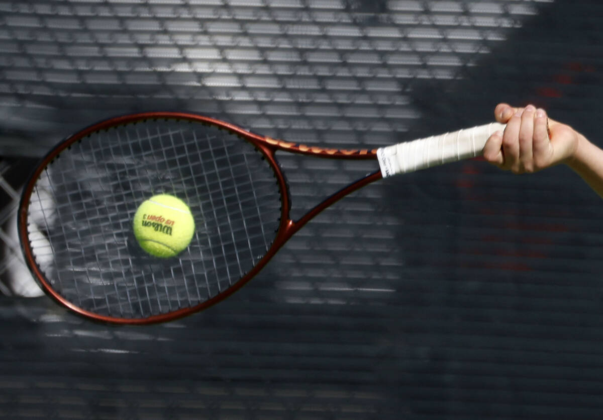 The Meadows' Levi Schaner returns the ball against Liberty during the 4A tennis team State ...