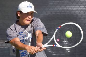 The Meadows' Jacob Garber returns the ball against Liberty during the 4A tennis team State ...
