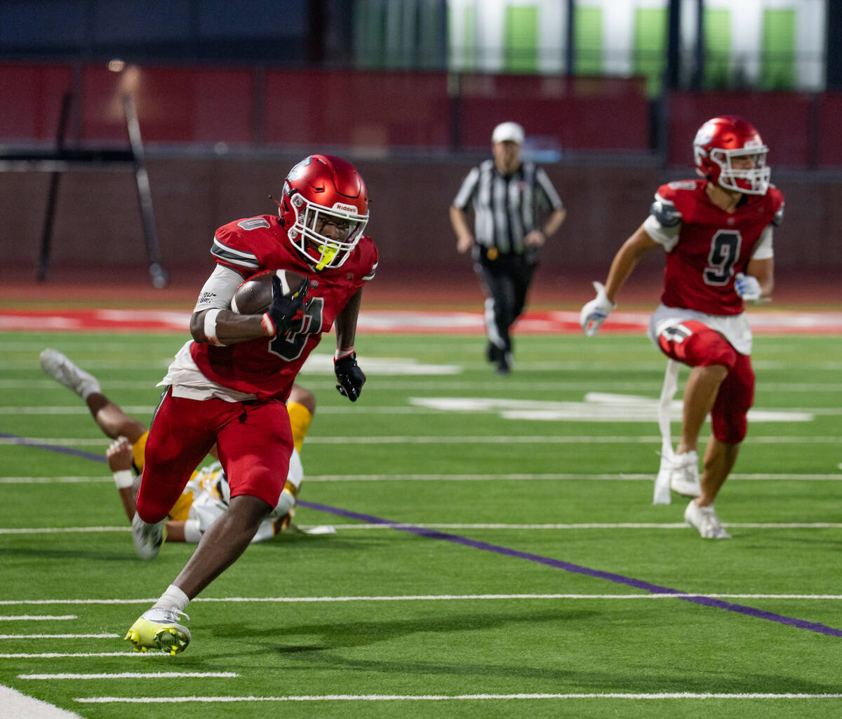 Arbor View running back Kamareion Bell (0) moves the ball during a football game between Milila ...